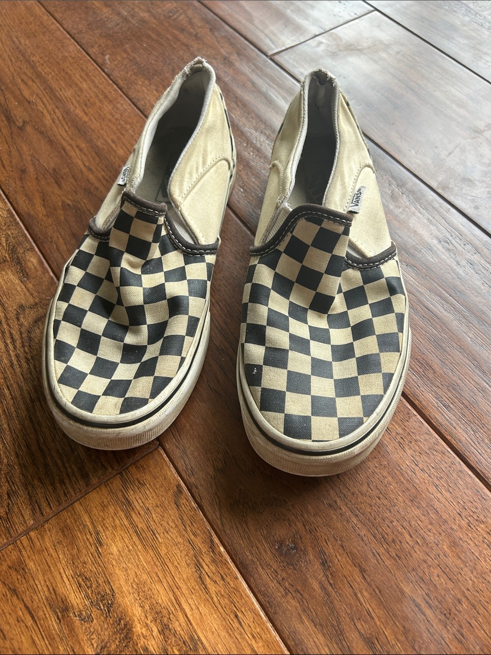 Vans Kids Checkerboard Slip-On Sneakers in Black and Cream
